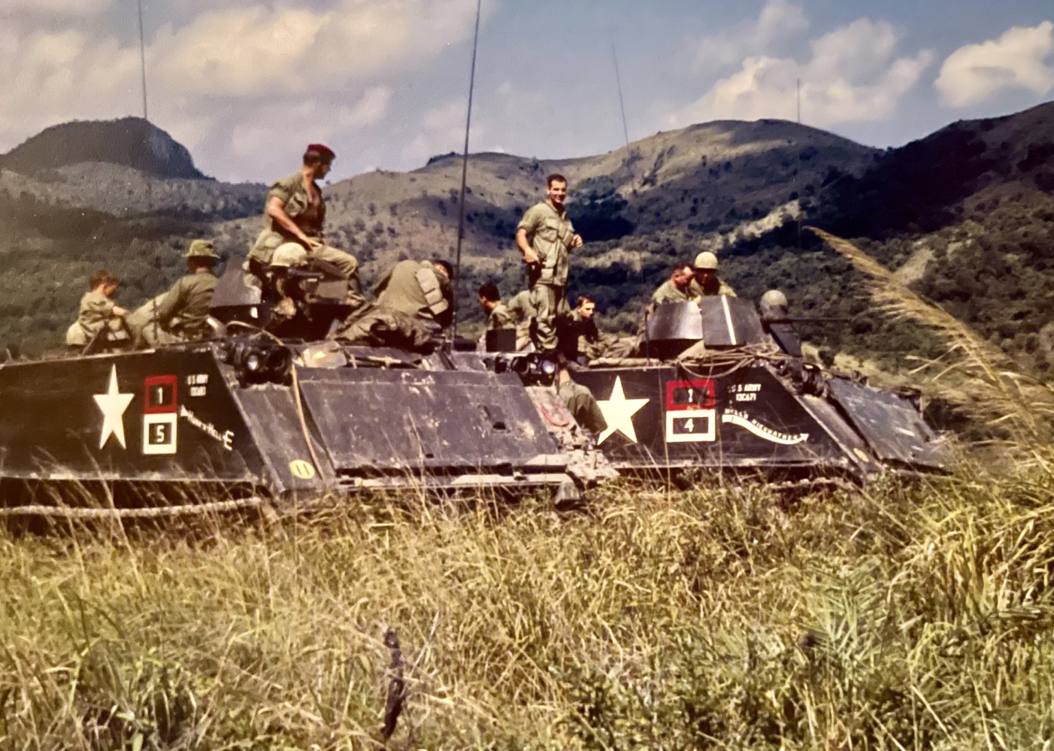 Members of H Troop's 1st Platoon aboard two ACAVs in mountainous terrain