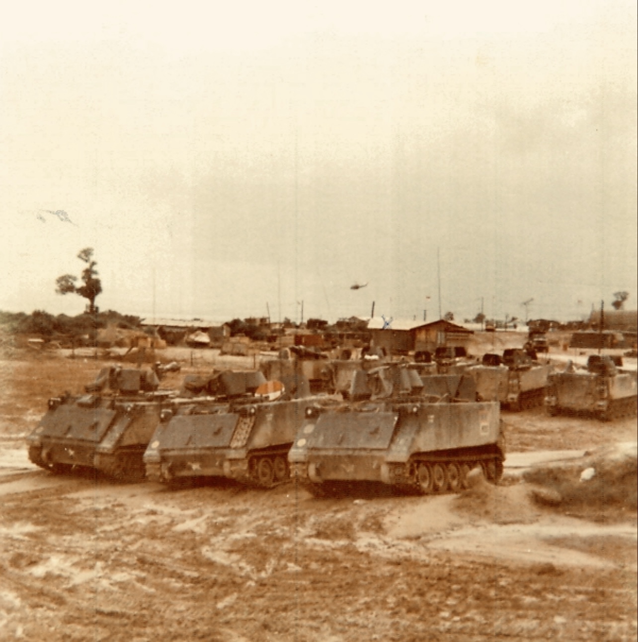 M113 armored cavalry assault vehicles lined up at an H Troop base area in Vietnam