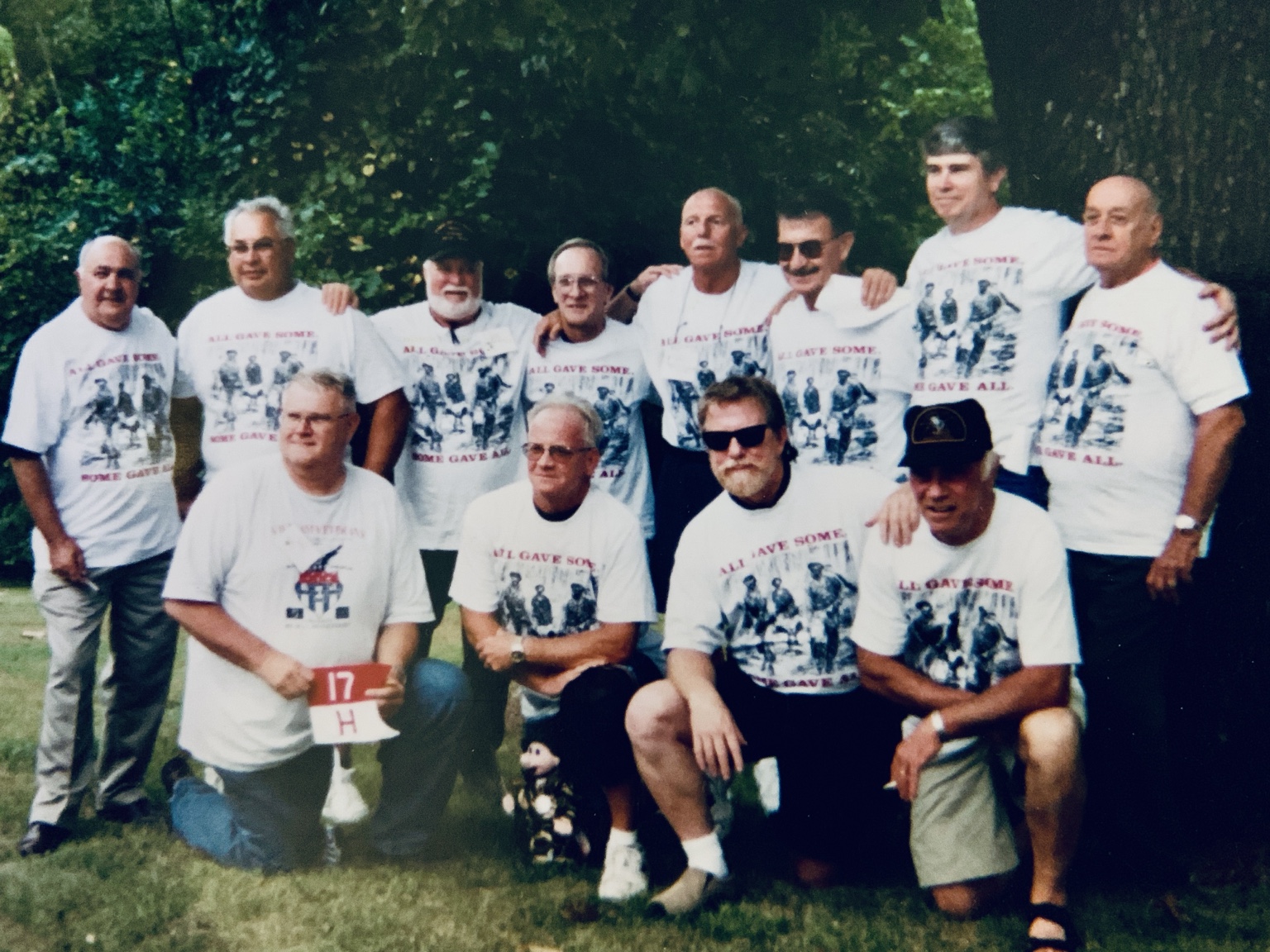 H Troop veterans gathered for a reunion in matching white shirts
