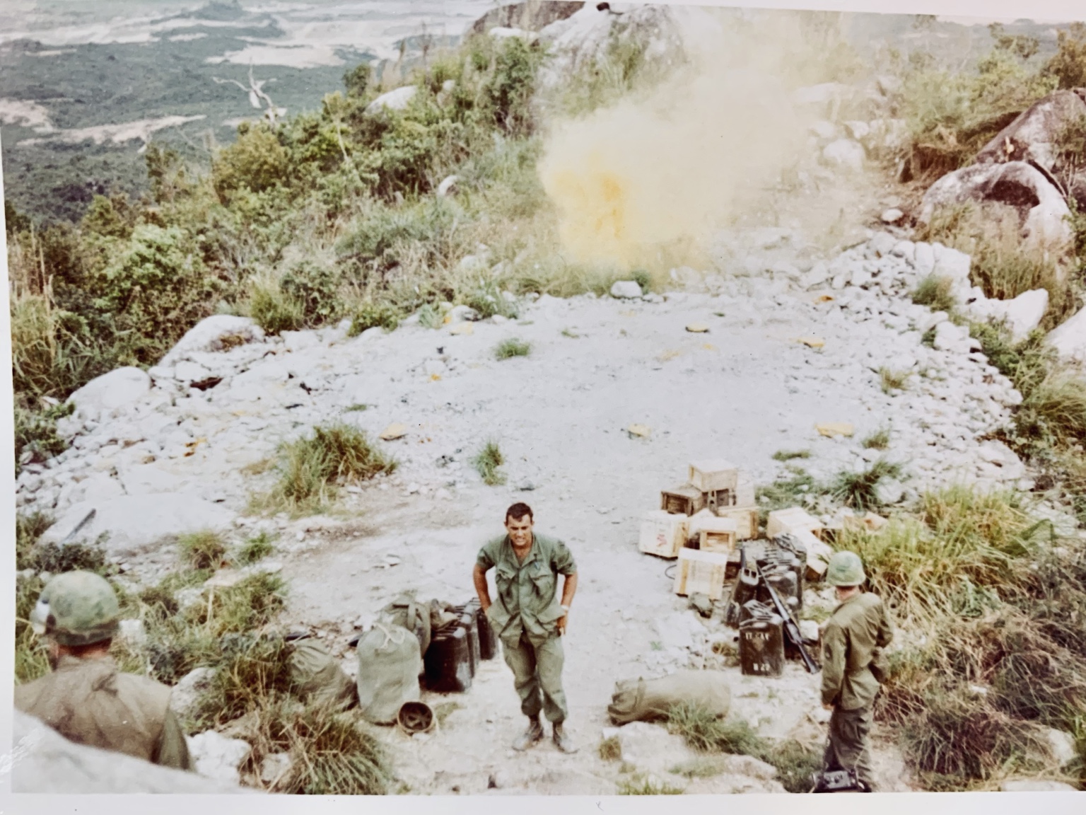 Troopers and supplies at a hillside position overlooking the surrounding terrain. Names, date, and location remain unidentified.