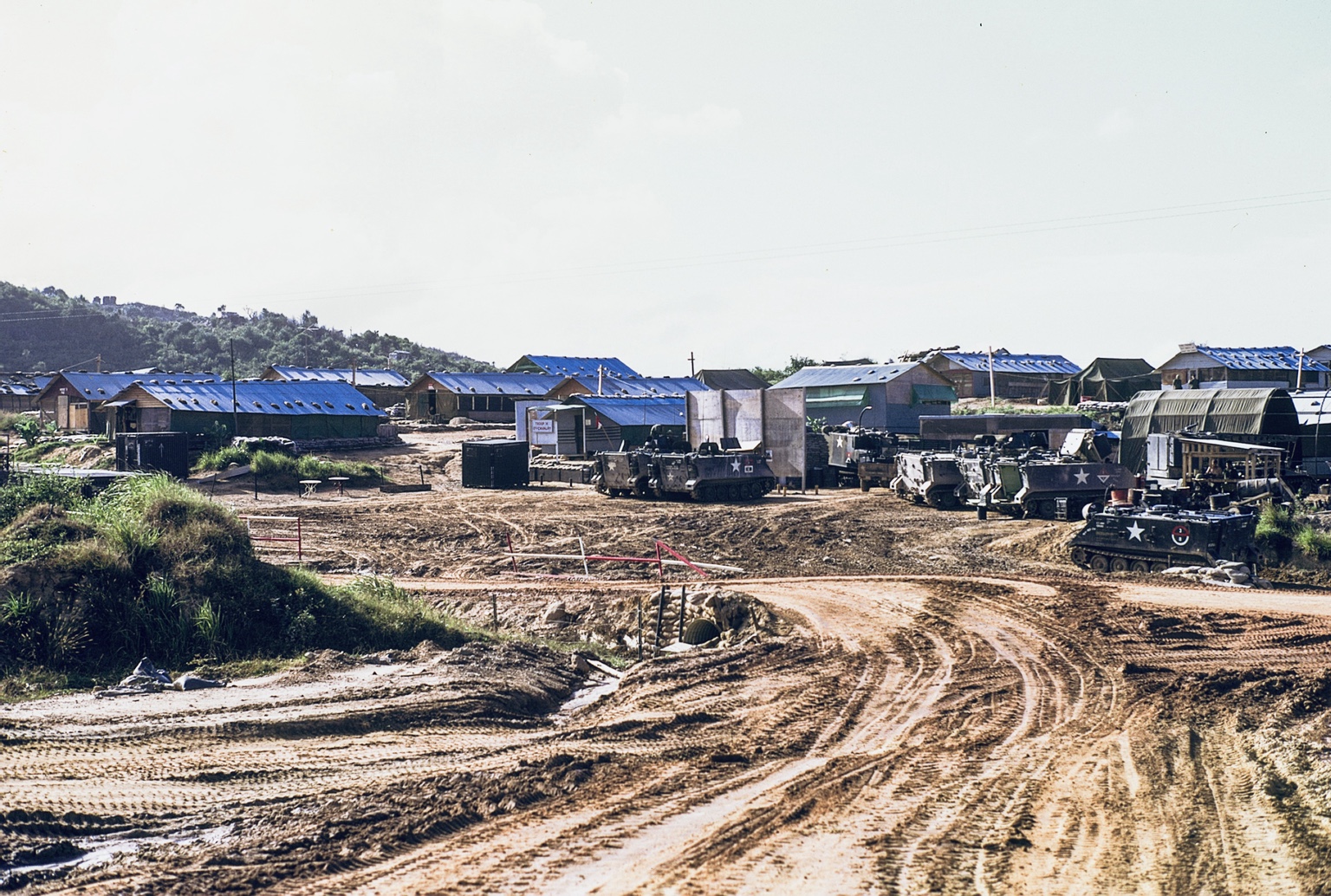 H Troop’s area at LZ Bayonet with armored personnel carriers, maintenance buildings, and living quarters.